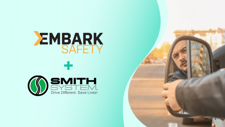 A man glances into a car side mirror while parked on a city street, embodying the essence of Fleet Driver Training. The scene prominently features logos for Embark Safety and Smith System with the tagline Drive Different. Save Lives.